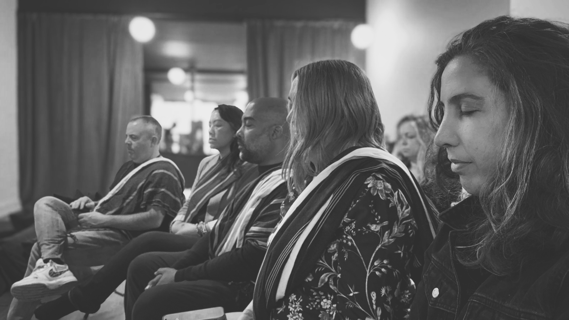 Sangha sitting together in meditation